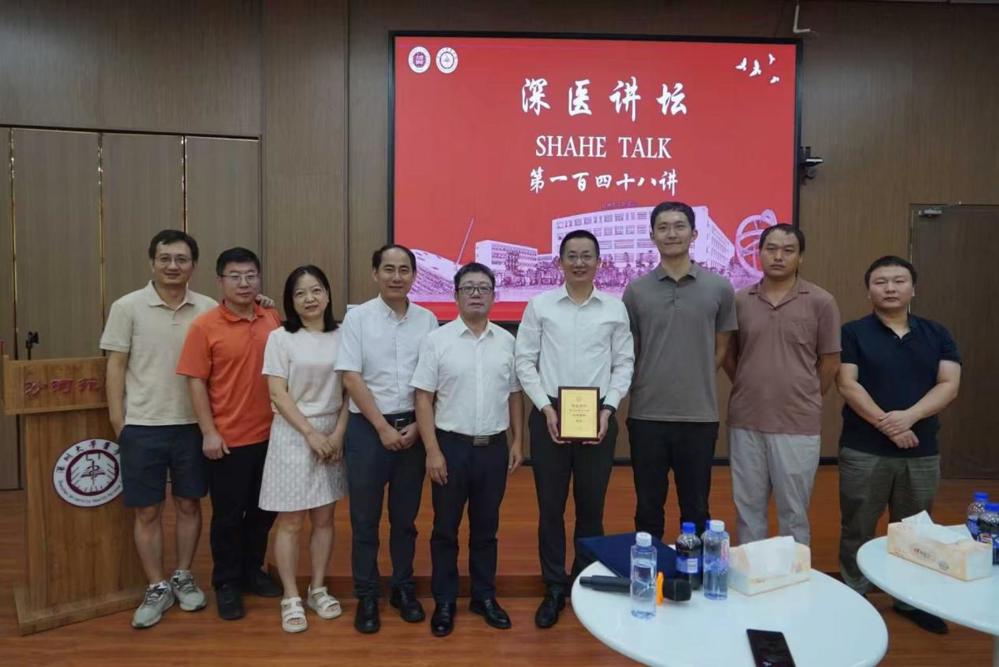 A group of people standing in front of a screen

AI-generated content may be incorrect.